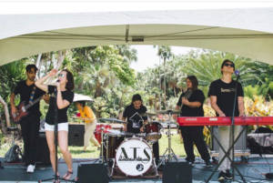 teachers performing from a music school in Miami