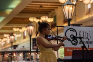 student performing for violin classes in Miami