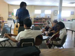 guitar classes in Miami - students taking an after school class at Hyde Park Montessori