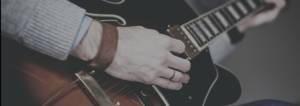 hand playing guitar