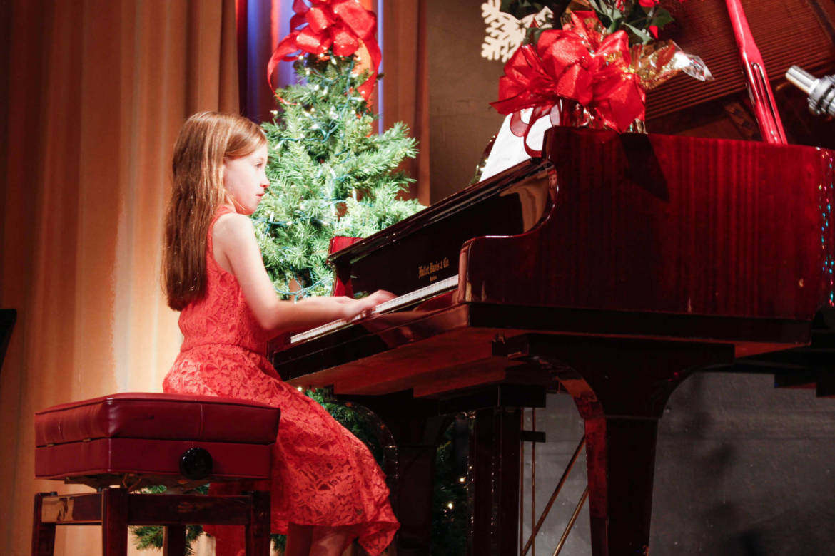 piano-classes-in-miami-student-shows-great-posture-at-holiday-recital-scaled.jpg